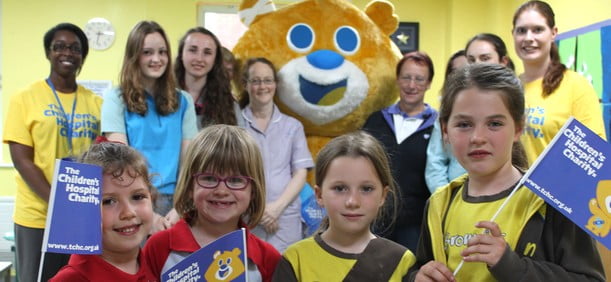 Theo bear charity with supporters
