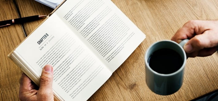Reading a book with a coffee