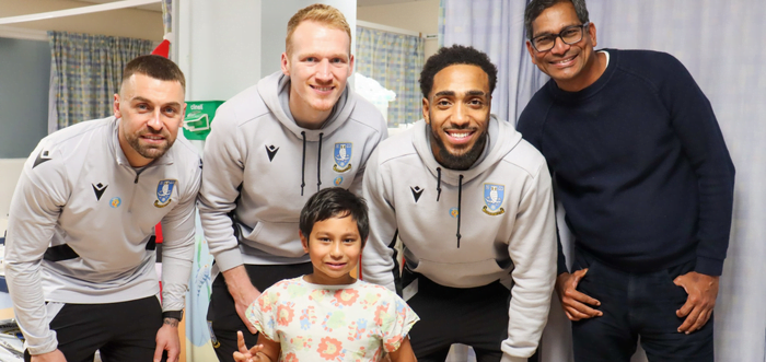 Sheffield Wednesday players with a patient