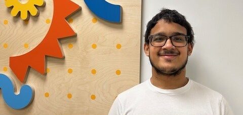 smiley teenager in white tshirt in front